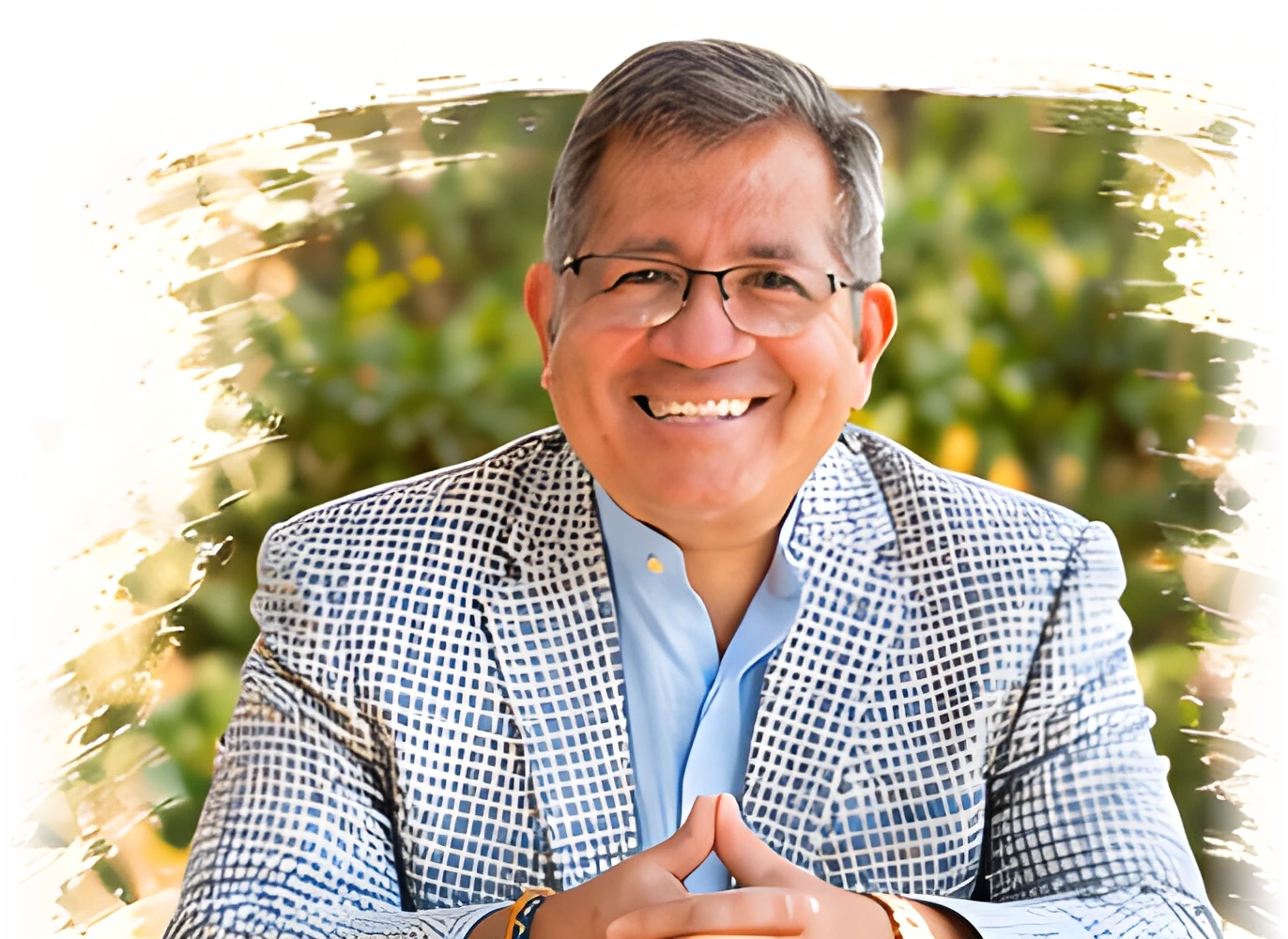 Ricardo Ortizcazarin, smiling, in a checked blazer